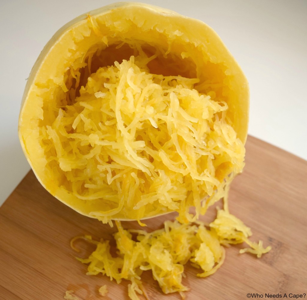 Spaghetti Squash showing the inside cooked squash on a cutting board.