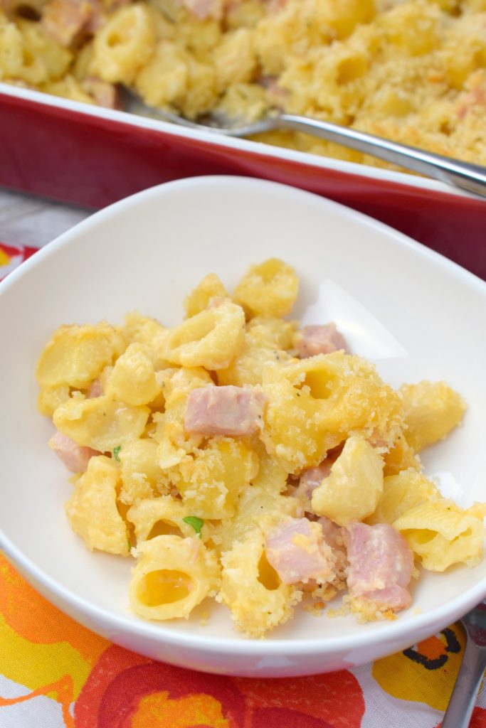 Here comes comfort food in the form of Baked Macaroni & Cheese with Ham. Use up that leftover holiday ham and make this homestyle cheesy dish.