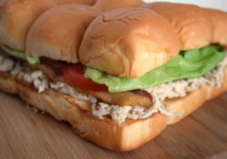 Bacon Caesar Chicken Sliders are so delicious! Layers of seasoned chicken, bacon, lettuce, tomato on buttery rolls, perfect for parties or tailgating.