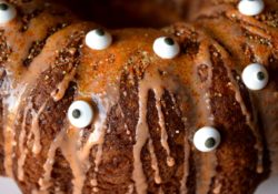 Boo! Make this super fun Orange You Scared? Halloween Cake. Wiith orange soda in the cake and the glaze plus spooky eyeballs it'll be the hit of your party!