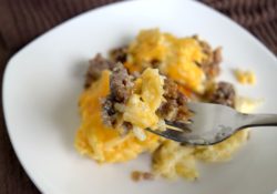 Liven up your comfort food with Cheesy Sausage & Hash Brown Casserole. Perfect for dinner, potlucks or as a holiday addition. So delicious!