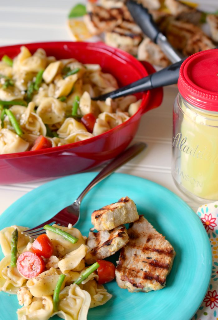 A taste of summer is what Asparagus Tortellini Pasta Salad brings to table. Loaded with deliciousness this side dish is ideal for grilling or parties.