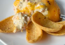 Perfect for holidays, parties or tailgating Loaded Slow Cooker Cheeseburger Dip is delicious! With cheeses and bacon, you know it'll be a great appetizer.