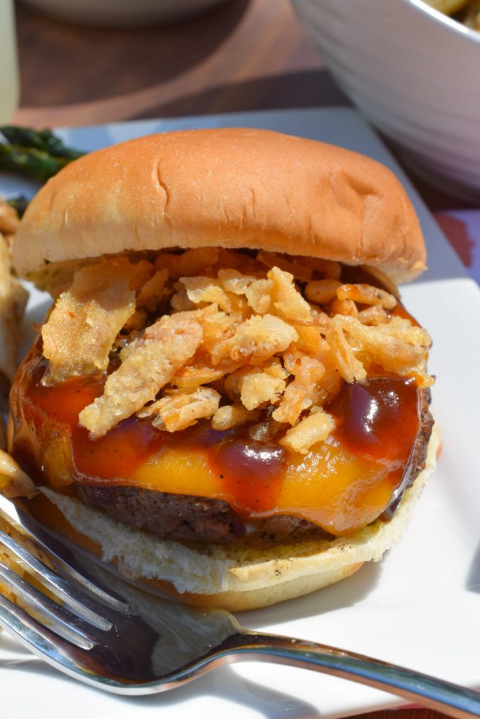 Fire up the BBQ grill and make some Cheddar Barbecue Burgers with Crispy Onions! An easy to prepare hamburger that is popping with delicious flavors.