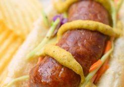 Bratwurst with Honey Dijon Broccoli Slaw is the perfect summer meal! A sweet and tangy slaw that pairs wonderfully with a grilled brat!