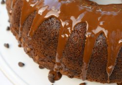 Glazed Chocolate Chip Apple Cake, the perfect addition to fall parties. A delicious spiced cake with a hint of chocolate & fresh apple, topped with a glaze.